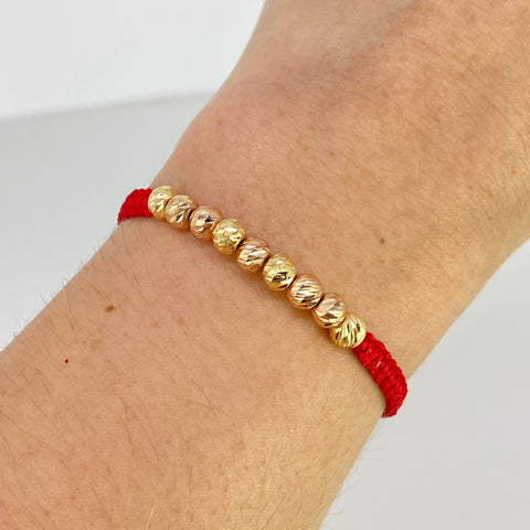 Pulsera tejida Bolas Diamantadas 9uni 5mm / Hilo Rojo Oro amarillo y Oro rosa 18k 1,08 Gr *