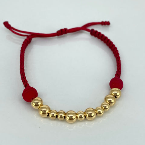 Pulsera tejida Bolas Lisas 11uni 5/4mm / Hilo Rojo Neoprenos Oro amarillo 18k 1,0 Gr *