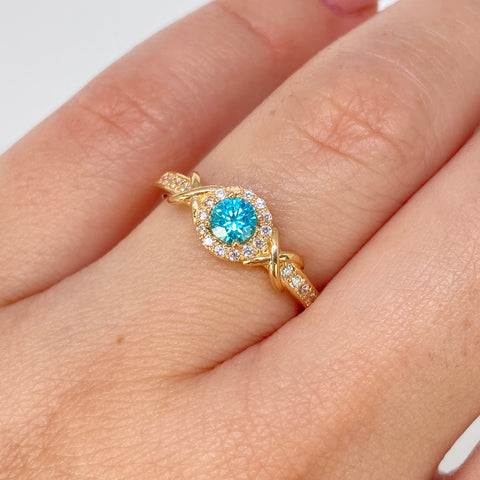 Anillo Solitario Cruzado Circones Blancos Celeste Oro amarillo / Talla 6 3/4 / 2,25 Gr *
