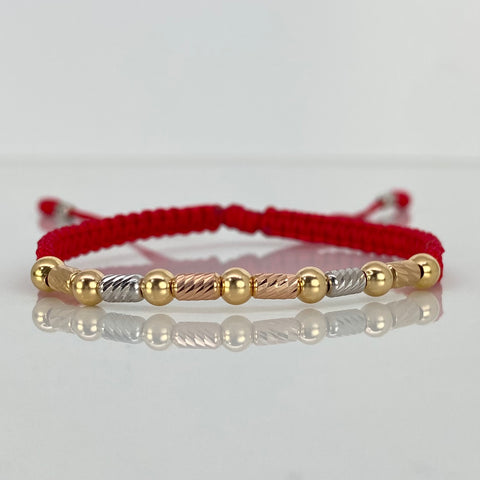 Pulsera tejida Bolas Lisas 7uni 4mm / Cilindros 8uni 3mm / Hilo Rojo Tres oros 18k 1,48 Gr *