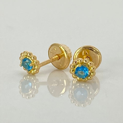 Topos Flor Circon Celeste Oro amarillo 18k 0,8 Gr / 5 mm  *