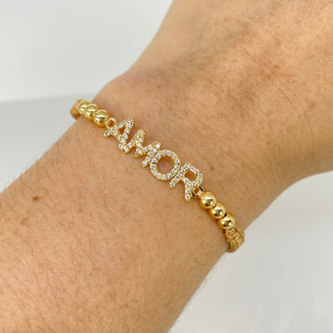 Pulsera tejida Herraje AMOR Circones Blancos / BL 6uni 4mm / Hilo Beige Oro amarillo 18k 1,55 Gr *